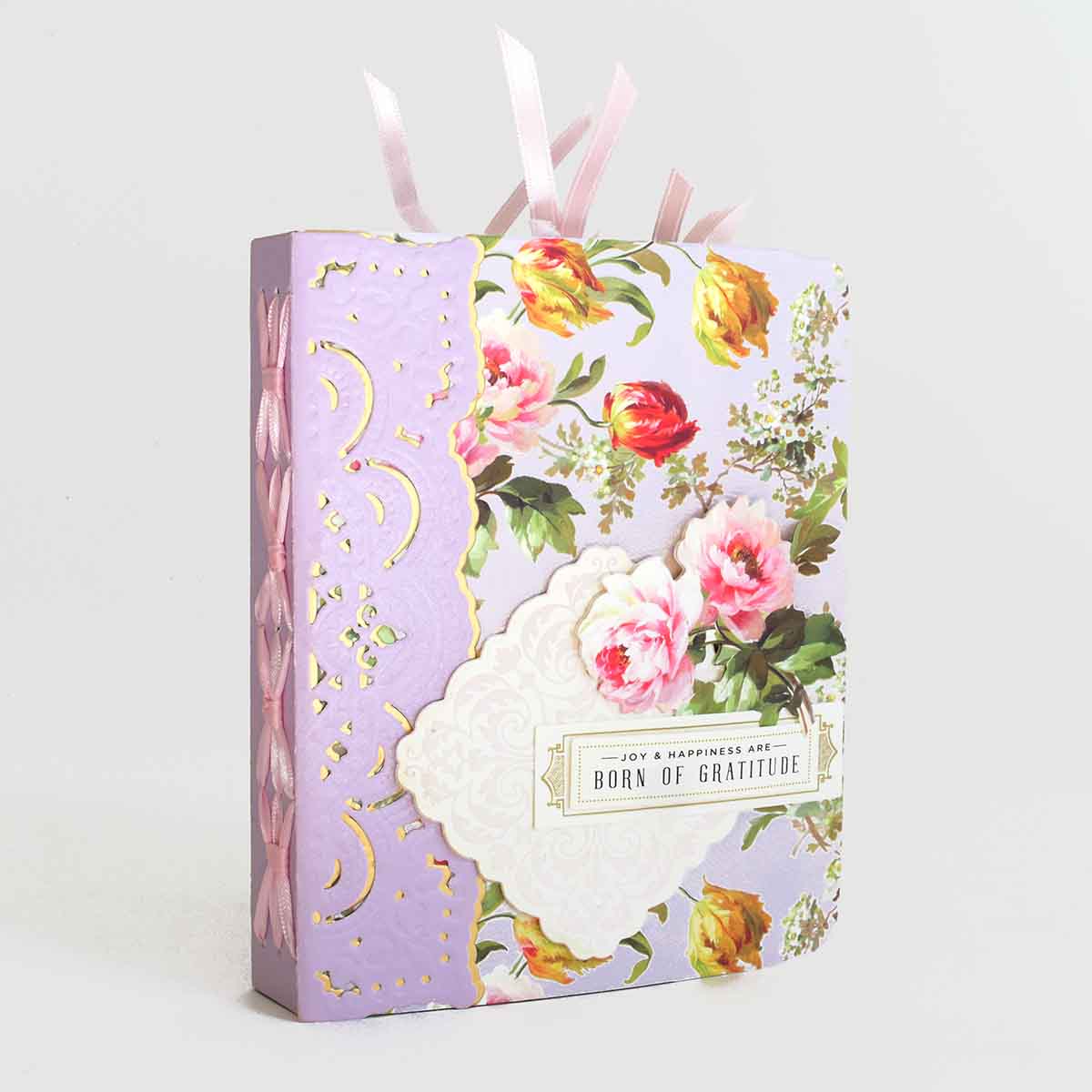 a purple box with pink and yellow flowers on it.