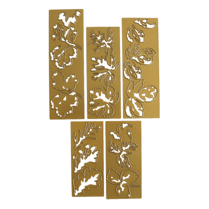 four pieces of gold foil with flowers on them.