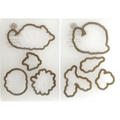 a couple of cookie cutters sitting on top of a white plate.