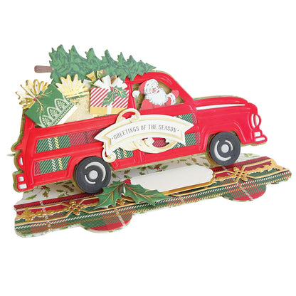 a red truck with a christmas tree on top of it.