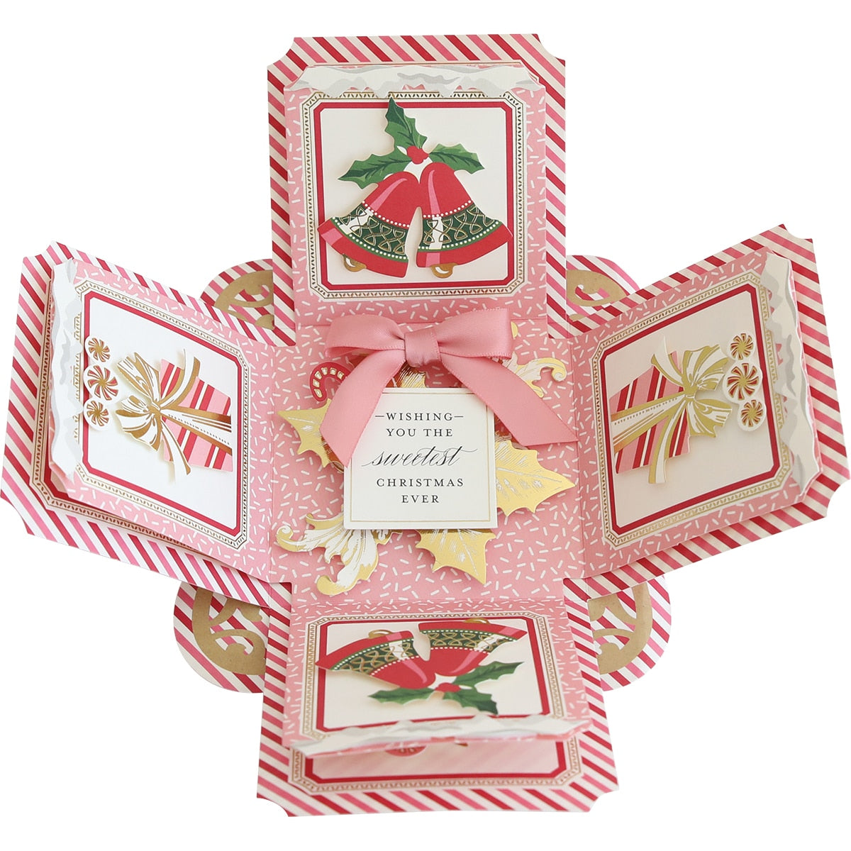 a folded christmas card with a bow and bells.
