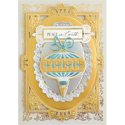 a card with a gold frame and a blue and white ornament.