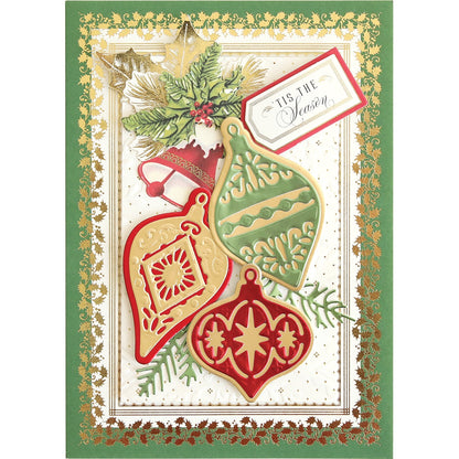a christmas card with ornaments and a tag.