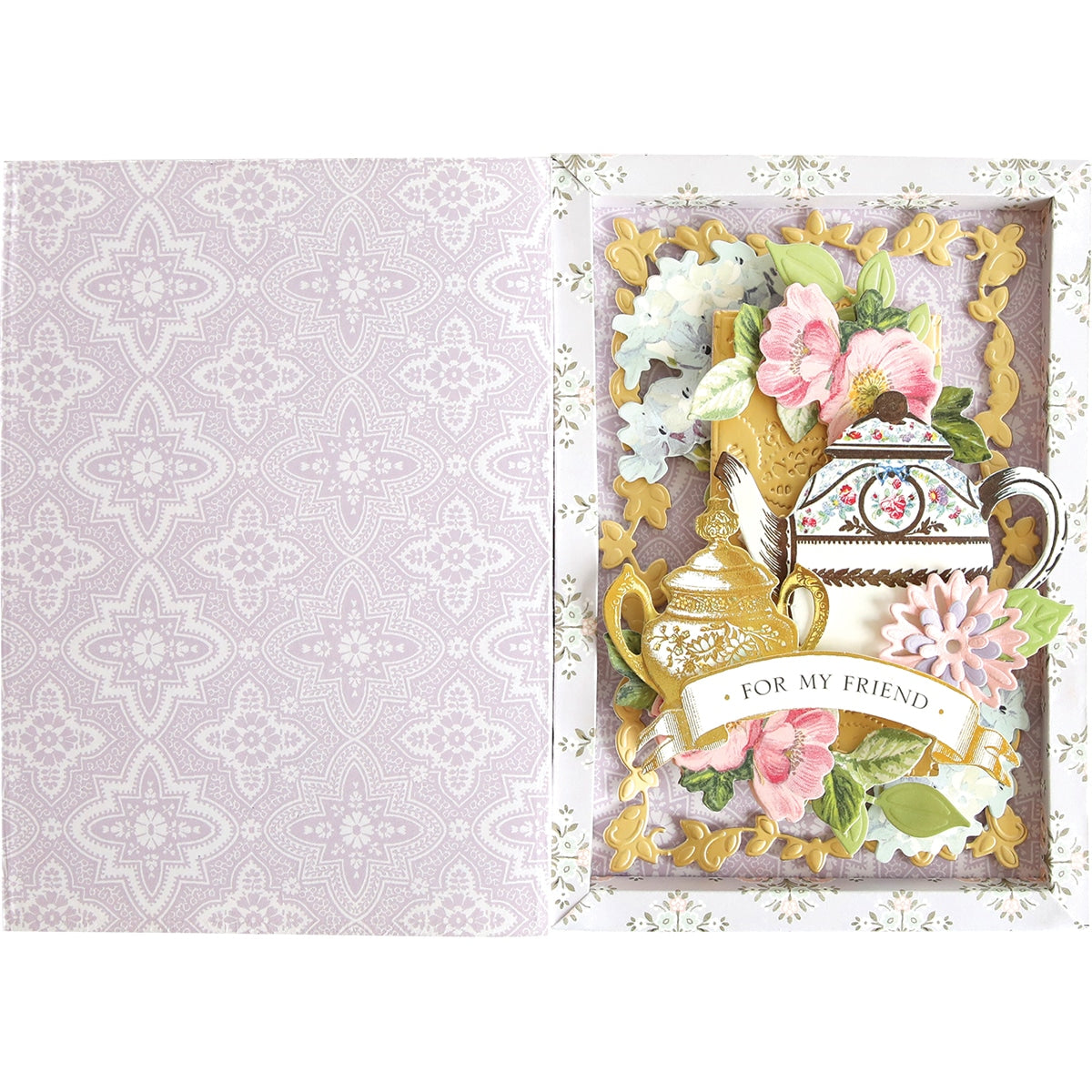 a card with a teapot and flowers on it.