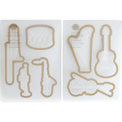 a set of cookie cutters with musical instruments.