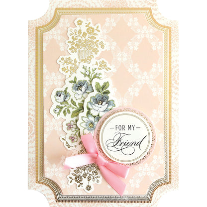 A Simply Friendship Card Making Kit with a pink ribbon and flowers.