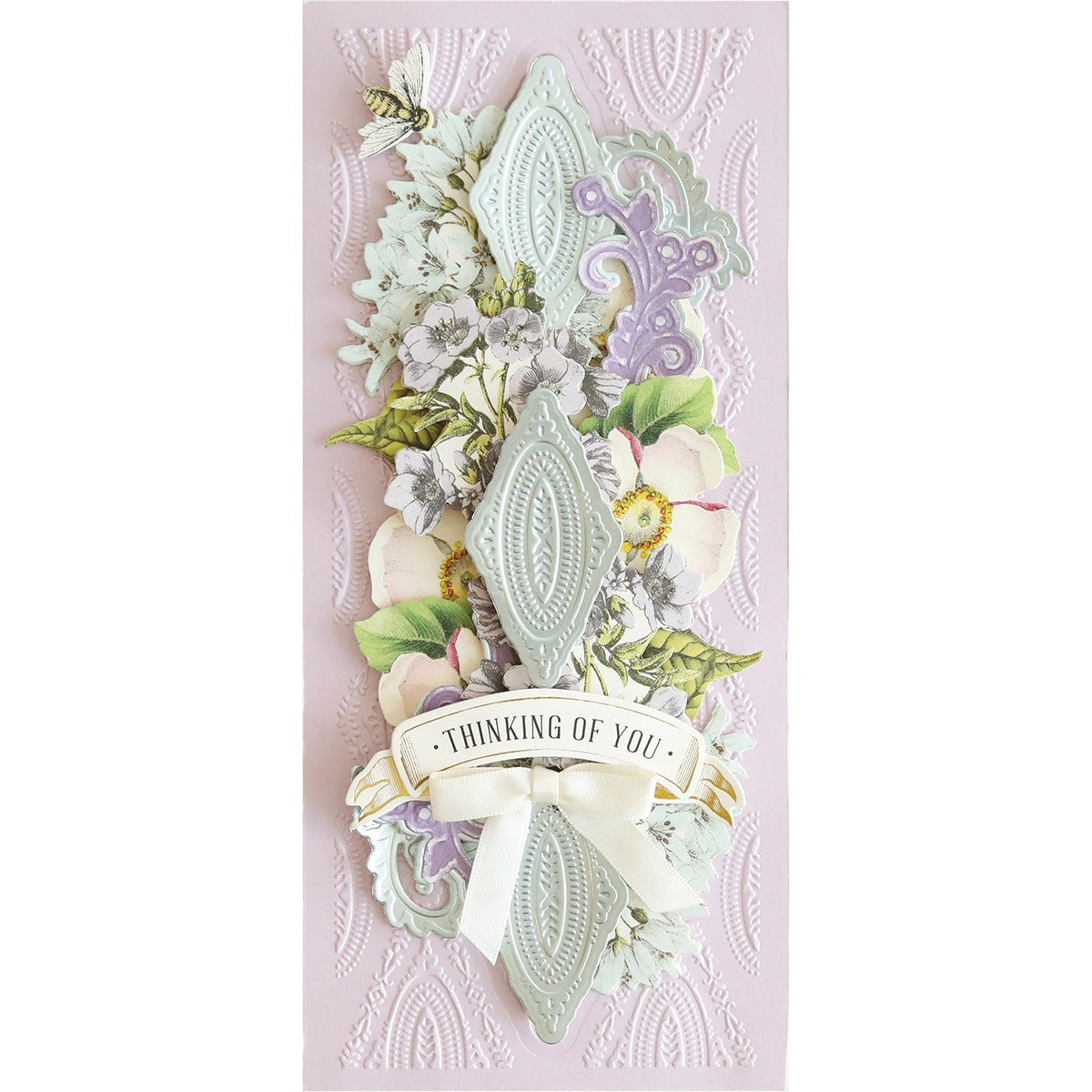 a card with a ribbon and flowers on it.