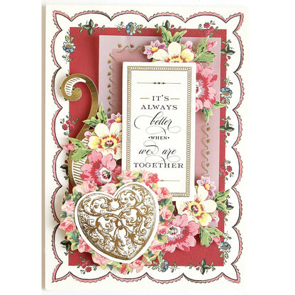 a card with a heart and flowers on it.