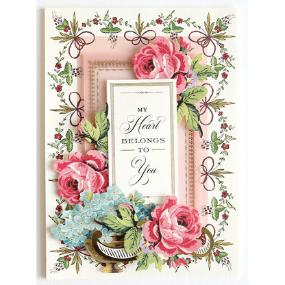 a card with flowers and a picture frame.