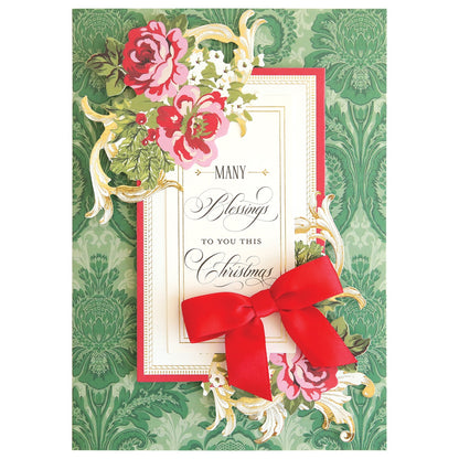 A Christmas Wishes Card Making Kit with a red bow on it.