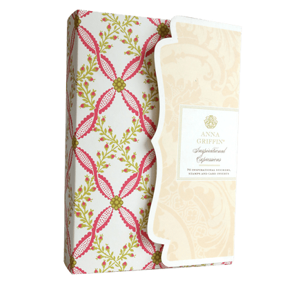 An Inspirational Expressions Sentiments and Stamps box with a pink and green design on it.