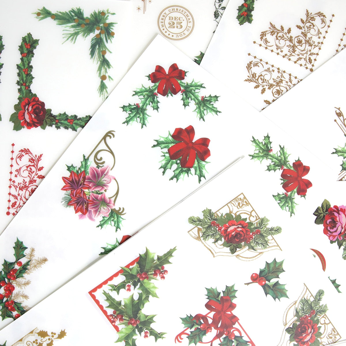 A collection of Christmas Ephemera Rub Ons with holly leaves and berries.