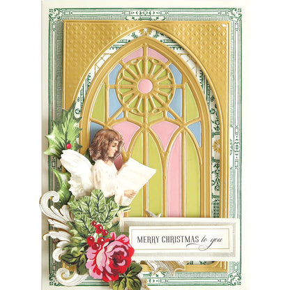 a christmas card with Stained Glass Card Front 4x6 Dies in front of a window.