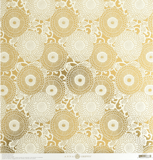 a gold and white paper with a pattern on it.