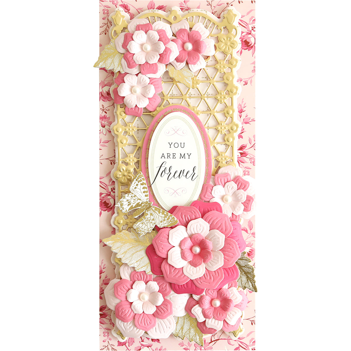 A pink and white Slimline Flower Cut and Emboss Folders card with flowers on it.