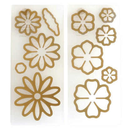 A set of Slimline Flower Cut and Emboss Folders in gold and white.