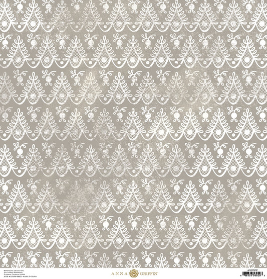 a white lace pattern on a gray background.