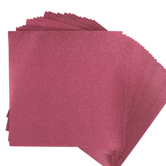 a stack of pink napkins on a white background.