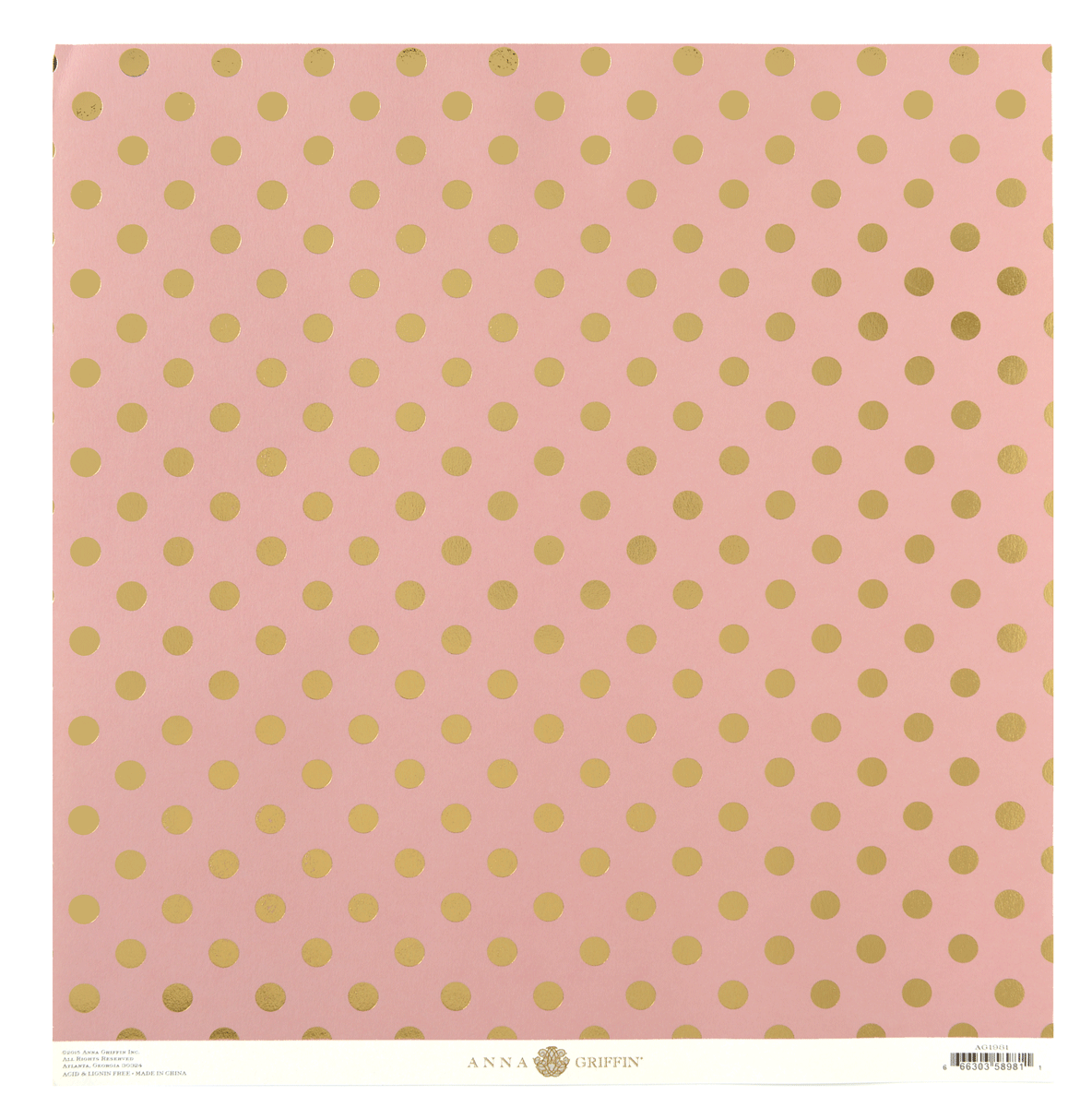 a pink background with gold polka dots.