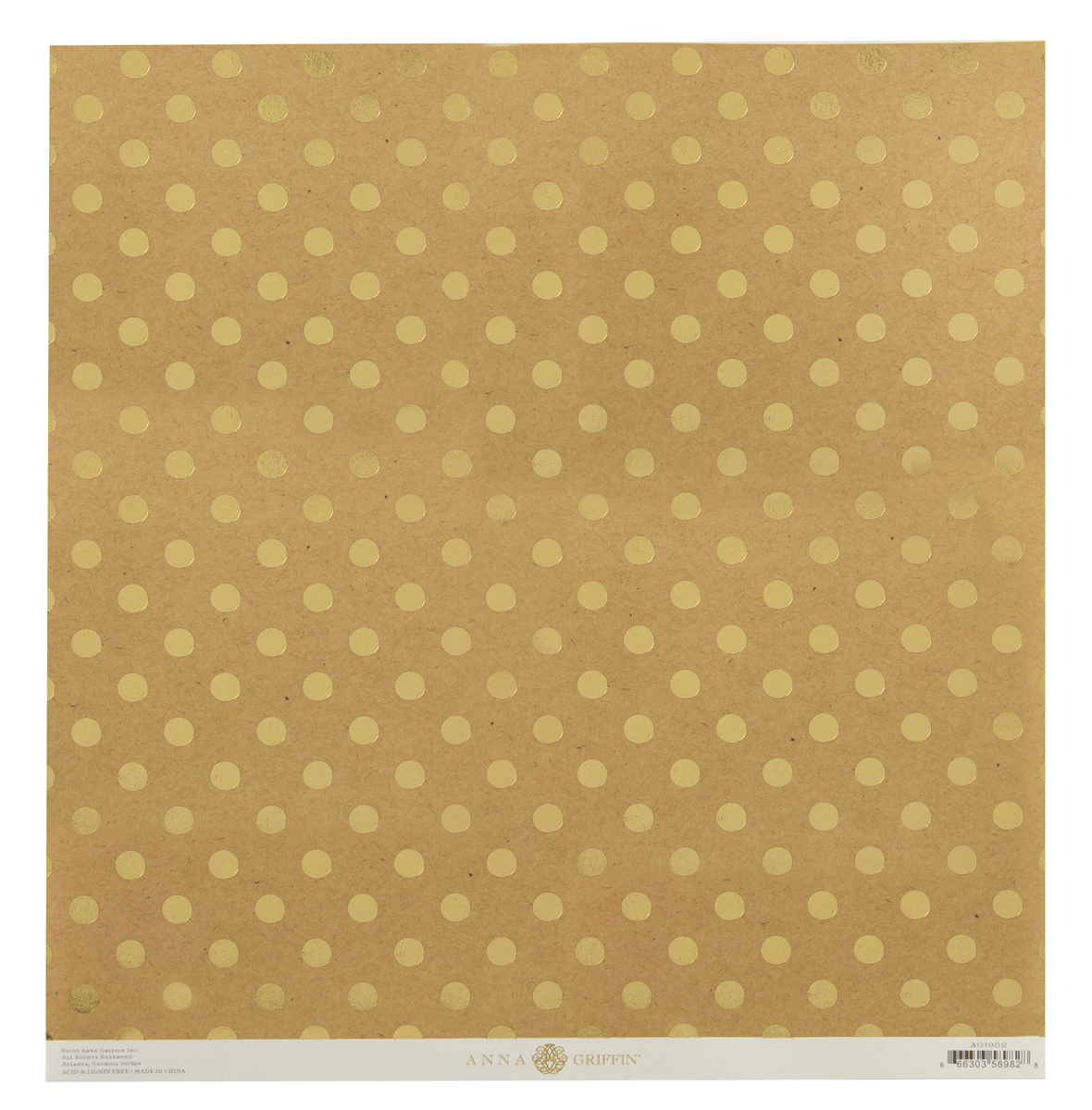 a piece of brown paper with gold polka dots on it.