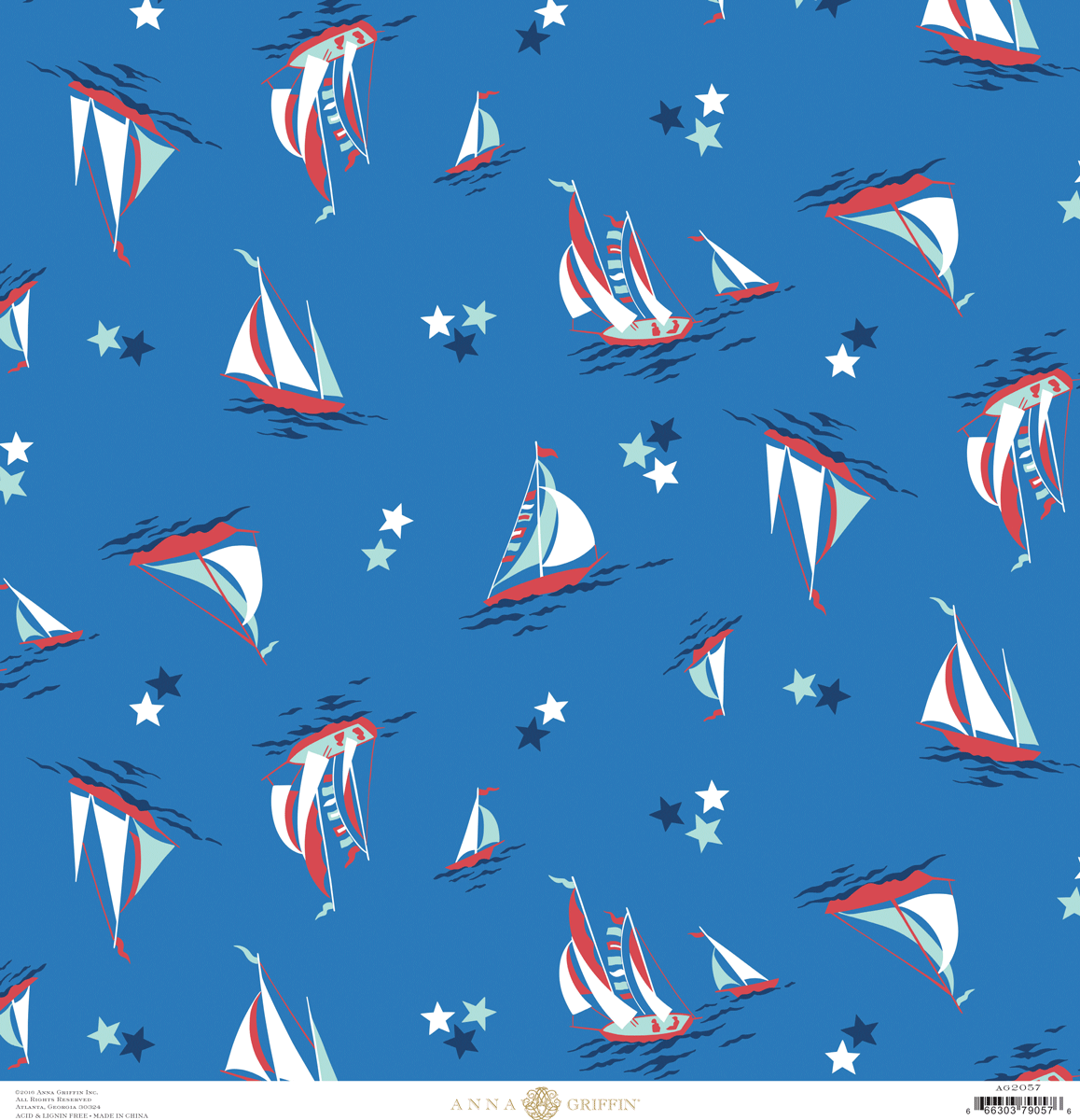 a pattern of sailboats and stars on a blue background.
