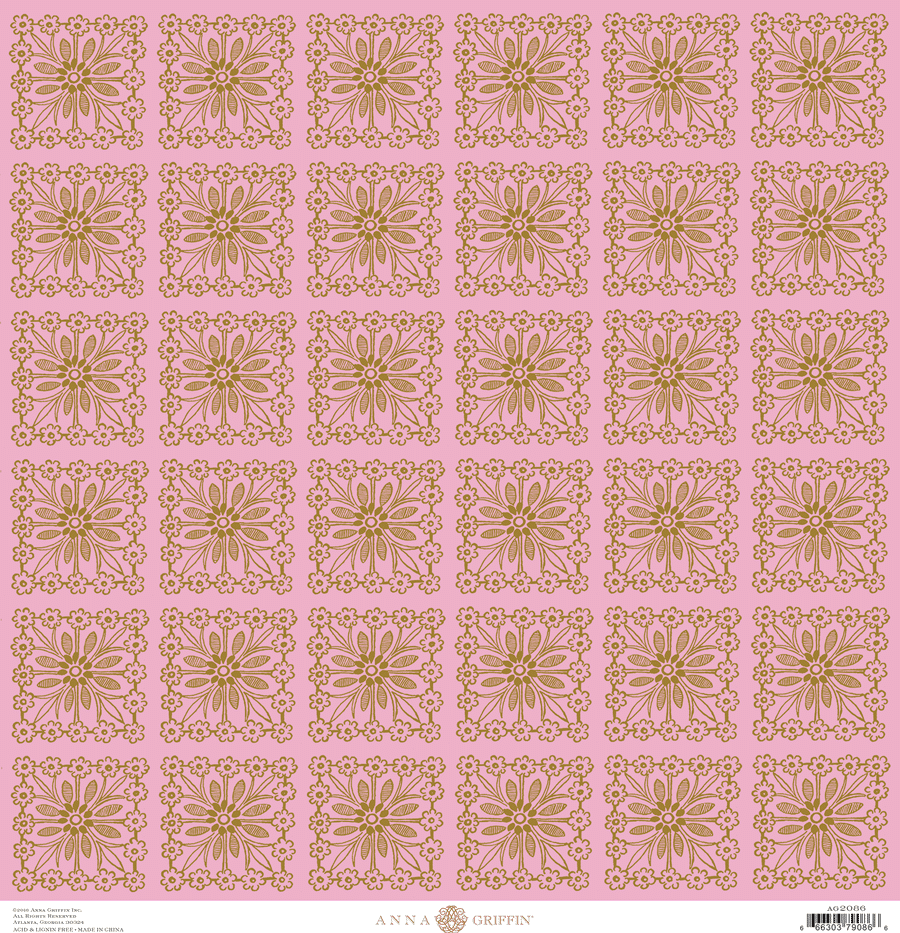 a pink and gold wallpaper with a flower design.
