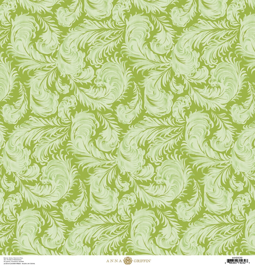 a green and white wallpaper with leaves.