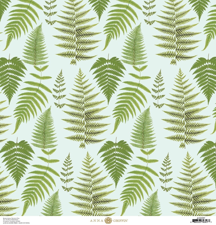 a green fern leaf pattern on a light blue background.