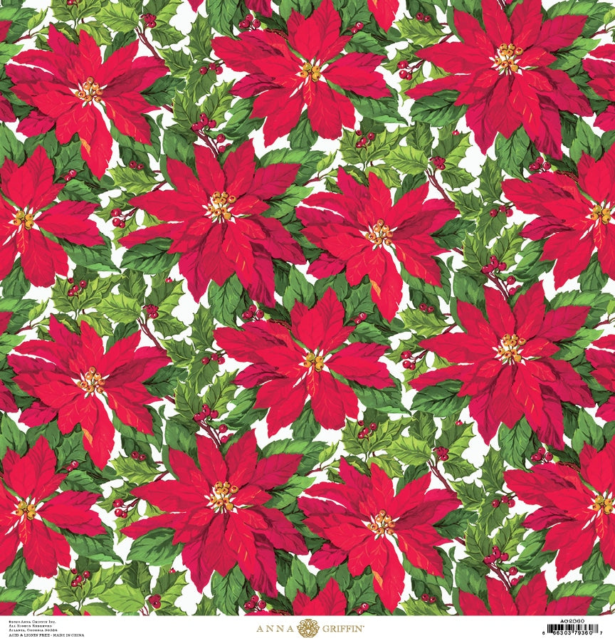 a red poinsettia with green leaves on a white background.