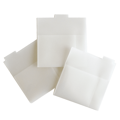 a group of three white envelopes sitting on top of each other.