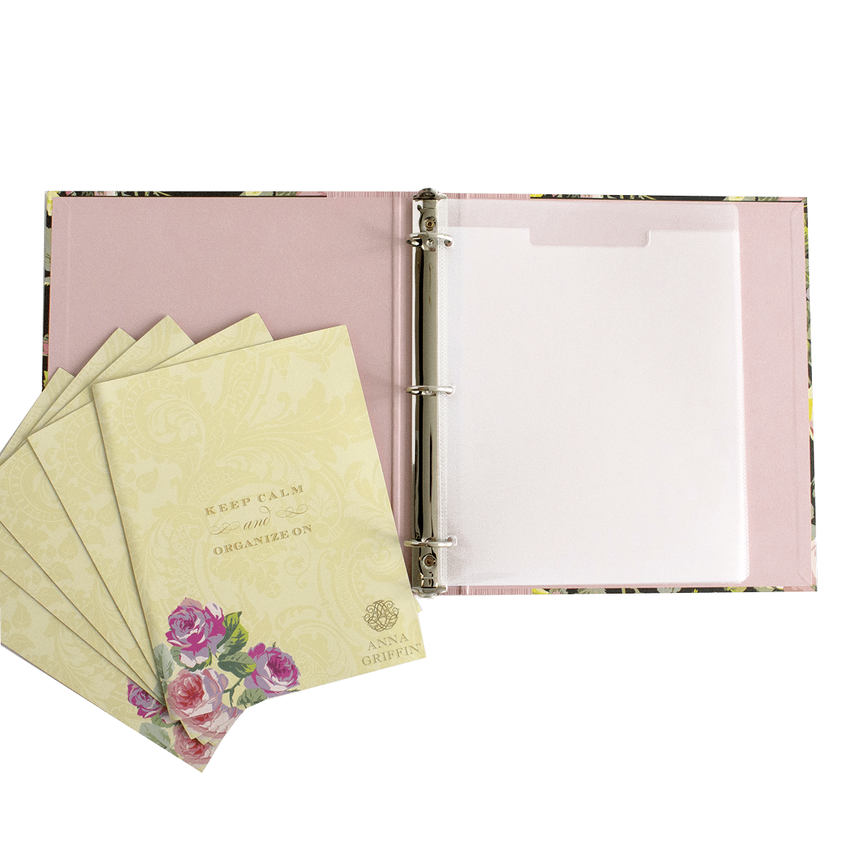 a pink binder with a bunch of papers on top of it.