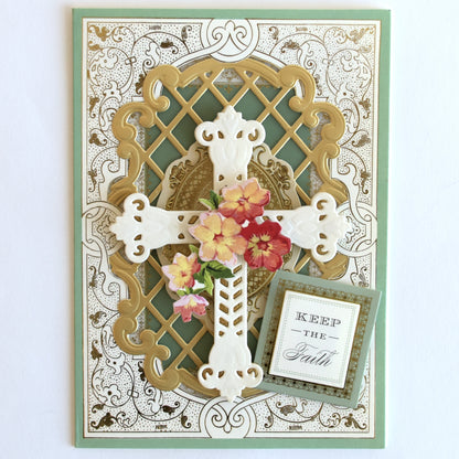 a card with a cross and flowers on it.