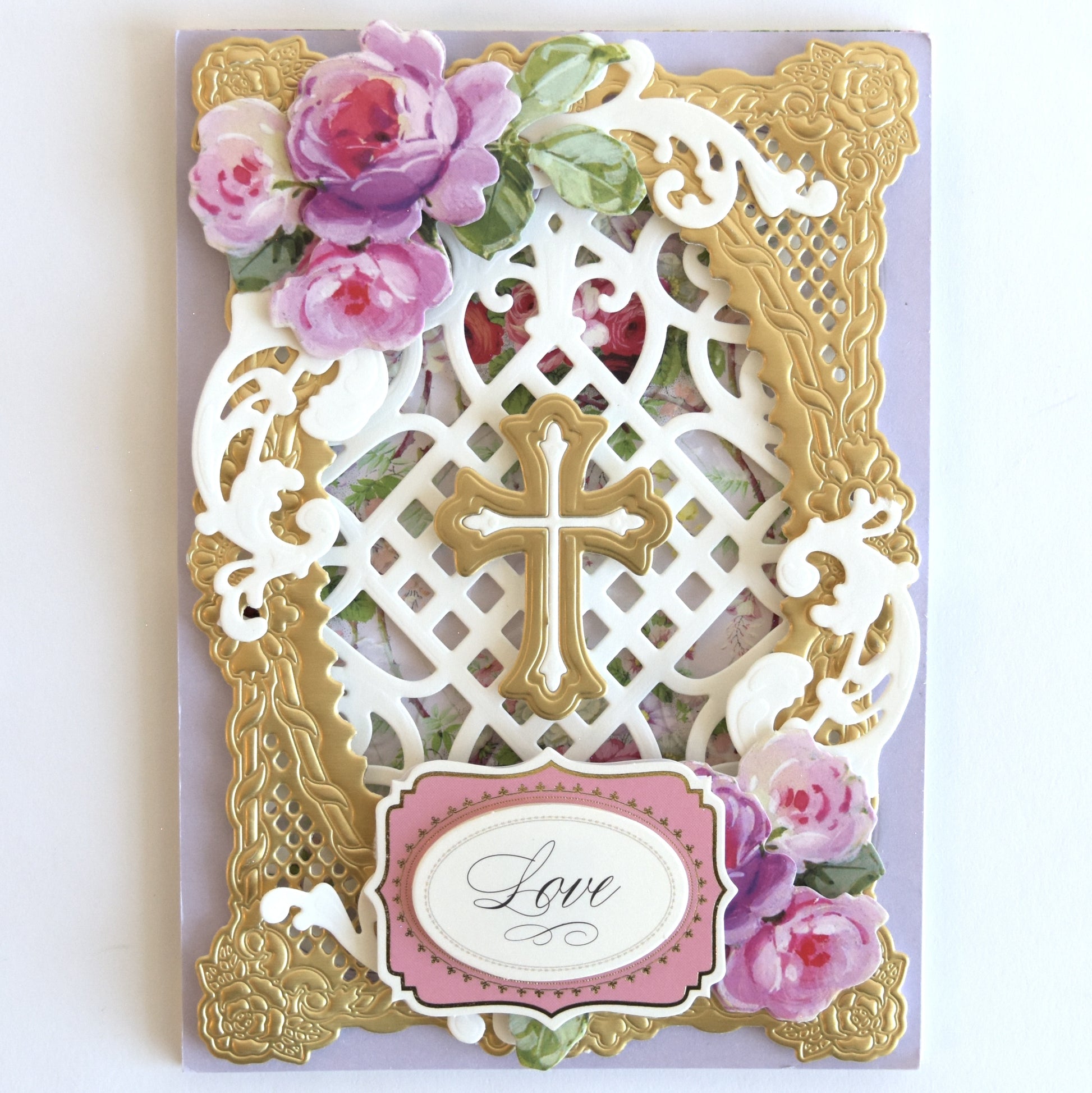 a card with a cross and flowers on it.