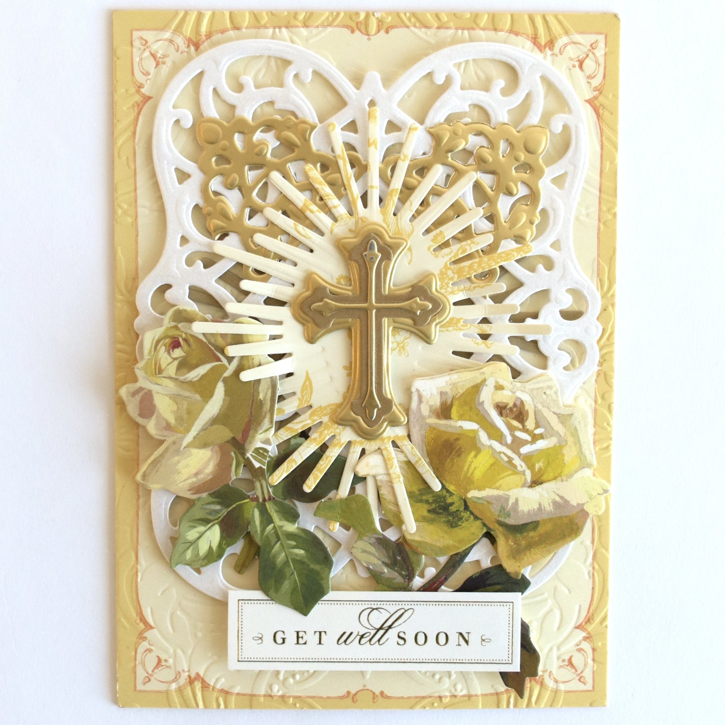a card with a cross and flowers on it.