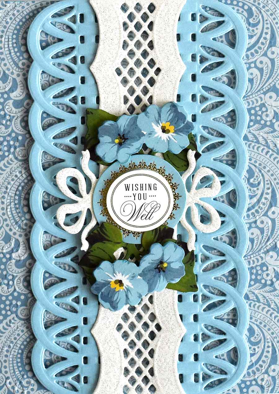 a blue and white card with flowers on it.
