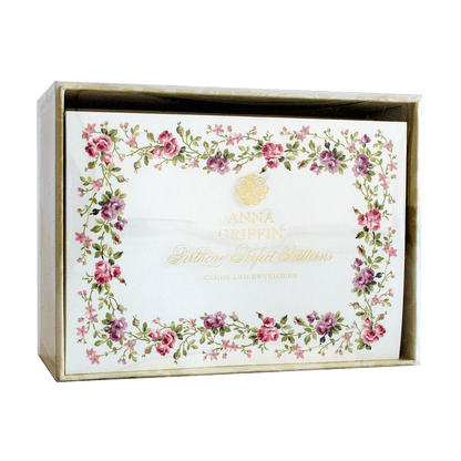 a white box with pink flowers on it.