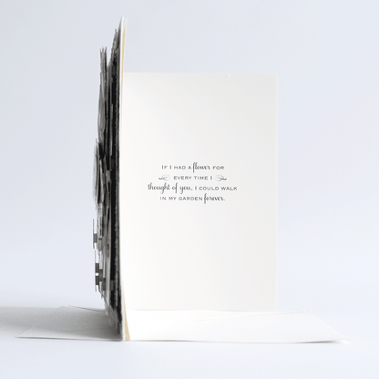 a white card with a black and white quote on it.