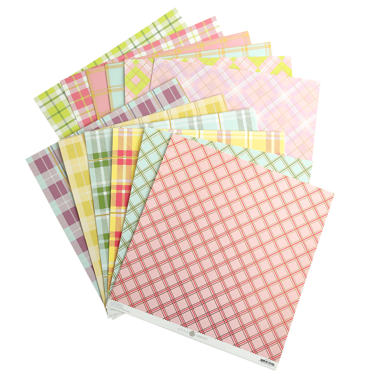 a pile of colorful plaid paper on top of each other.