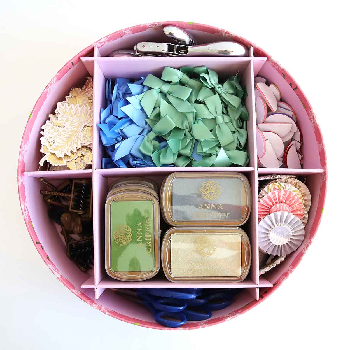 a pink container filled with lots of different types of candies.