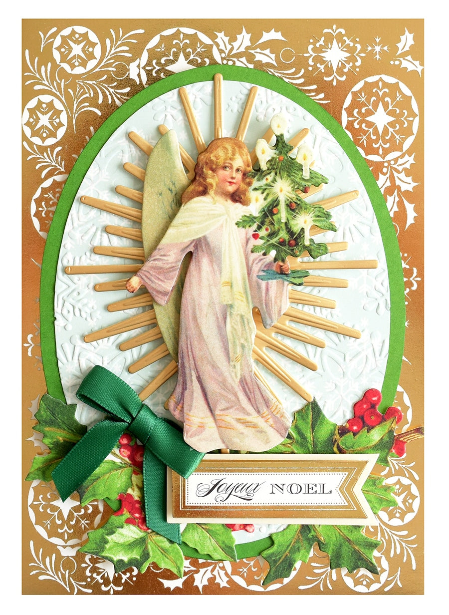 a christmas card with an angel holding a christmas tree.