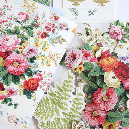 a table topped with lots of different types of flowers.