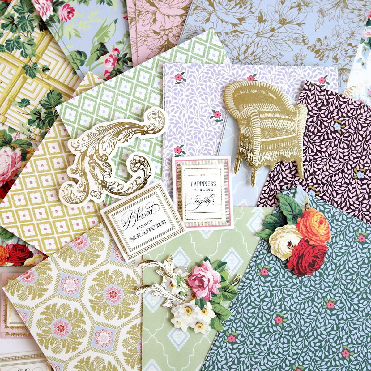 a bunch of different colored papers with flowers on them.