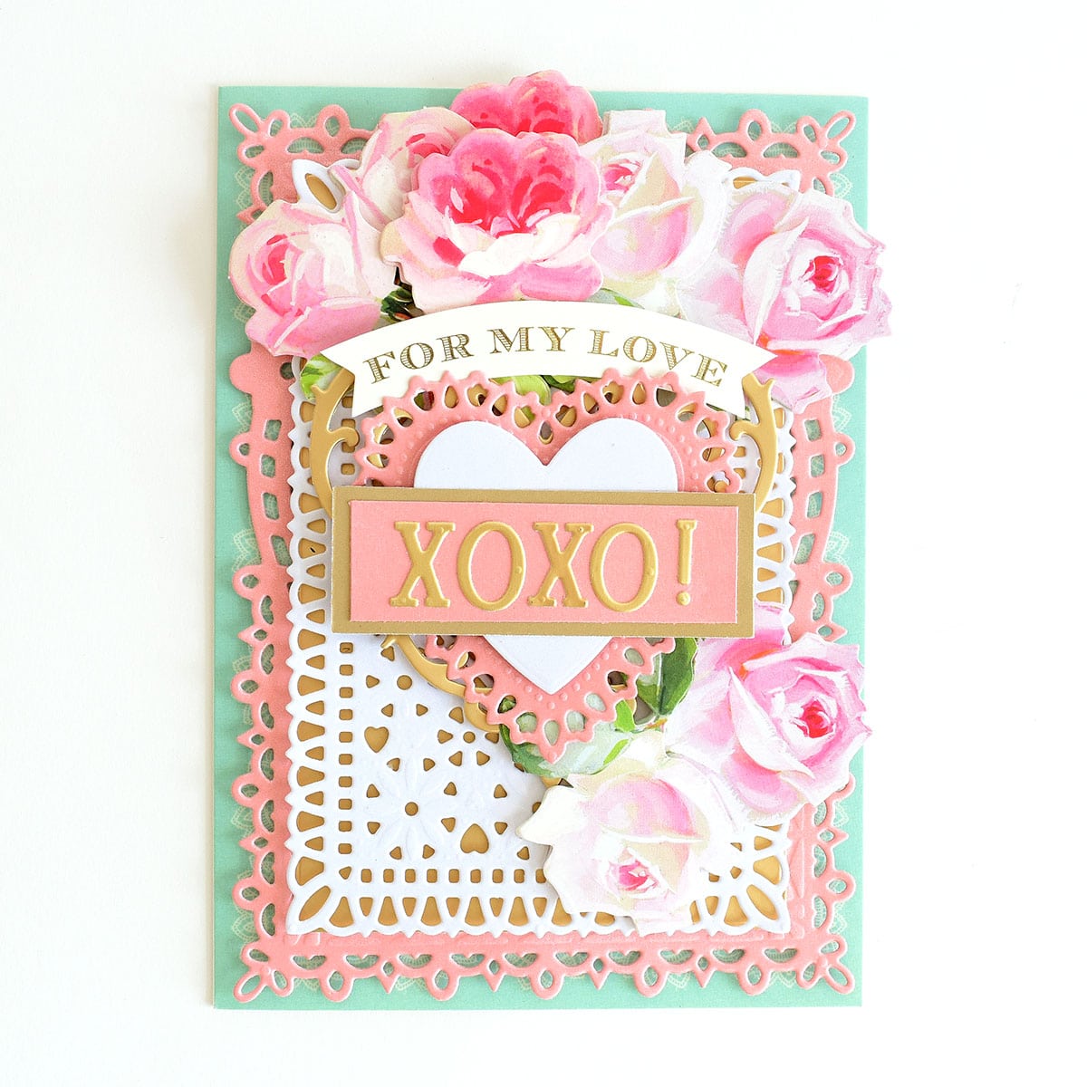 a card with a heart and flowers on it.