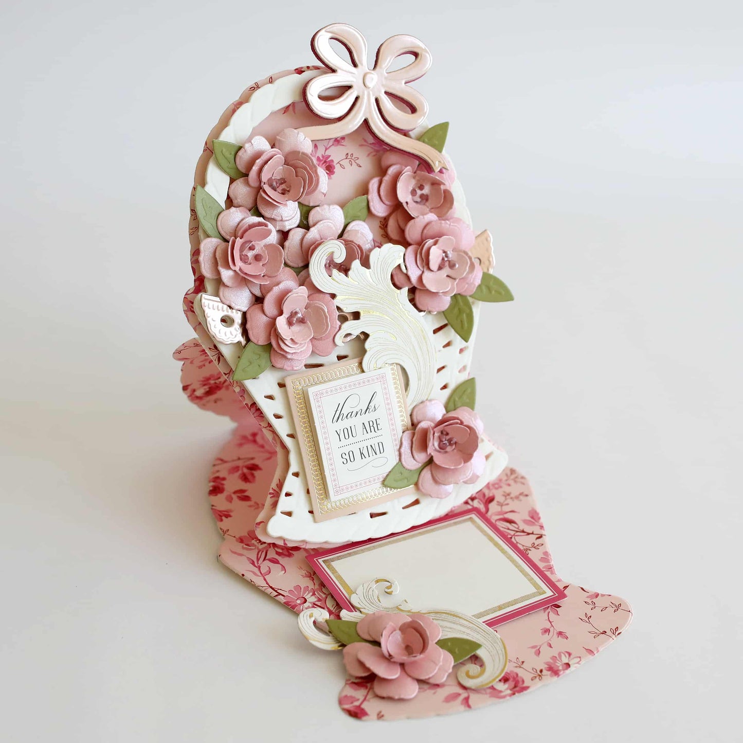 a card holder with flowers and a picture frame.