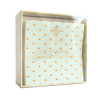 a white box with orange and yellow dots on it.