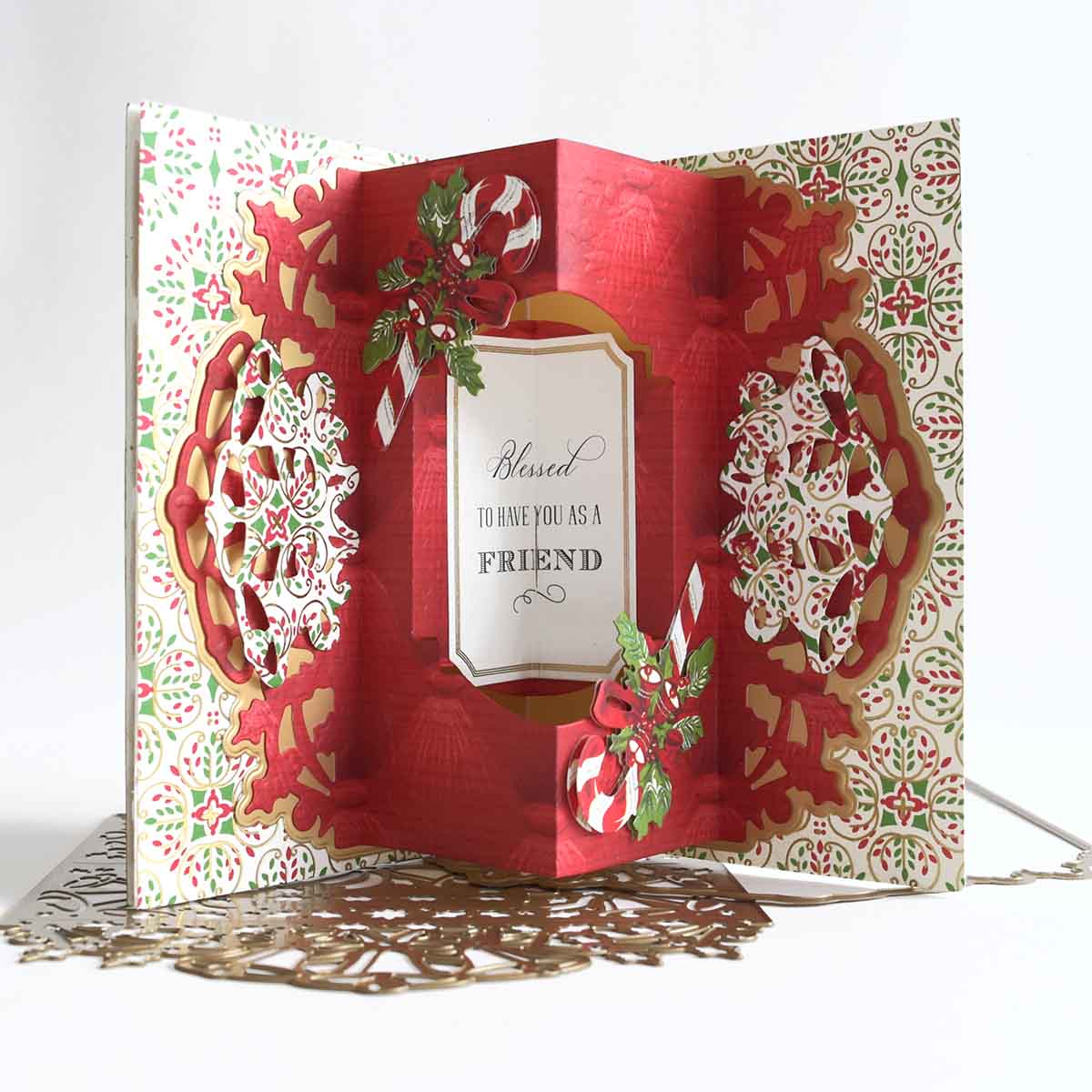 a red and white card with snowflakes on it.