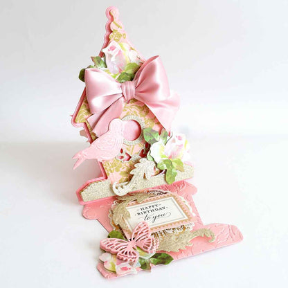 a pink card holder with a pink bow on top of it.