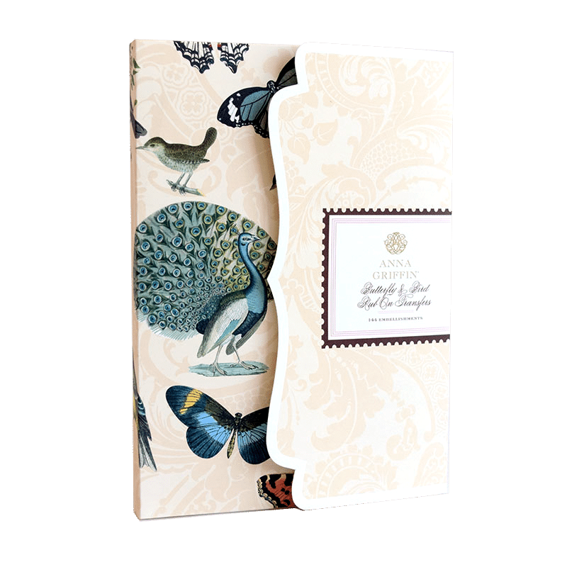 a book with a peacock and butterflies on it.