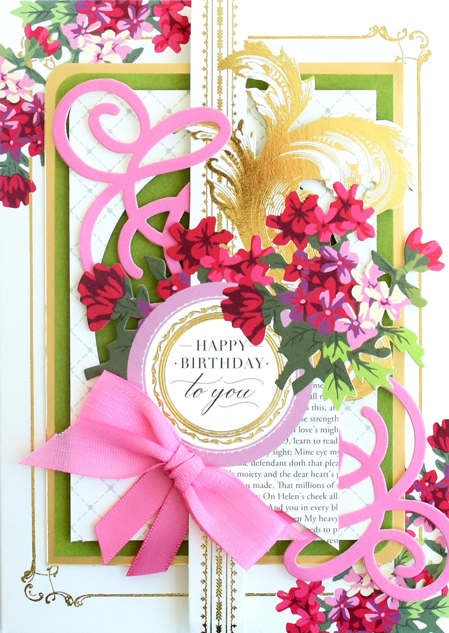 a close up of a birthday card with flowers.