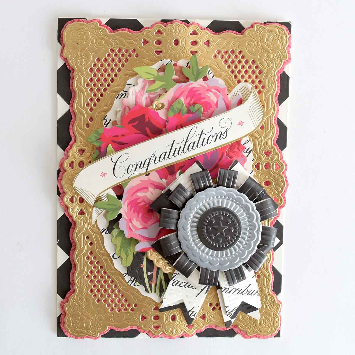 a congratulations card with flowers and ribbons.